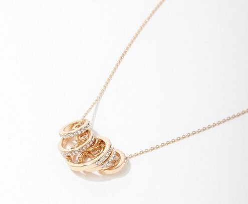 Gold hoop rhinestone pendant necklace—round triple-ring pendant detail