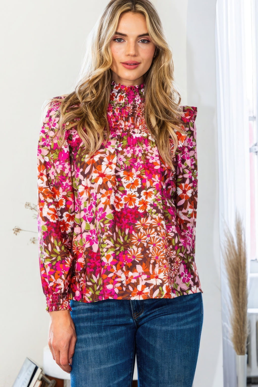 Dark pink floral mock neck blouse with smocked yoke and long cuffed sleeves