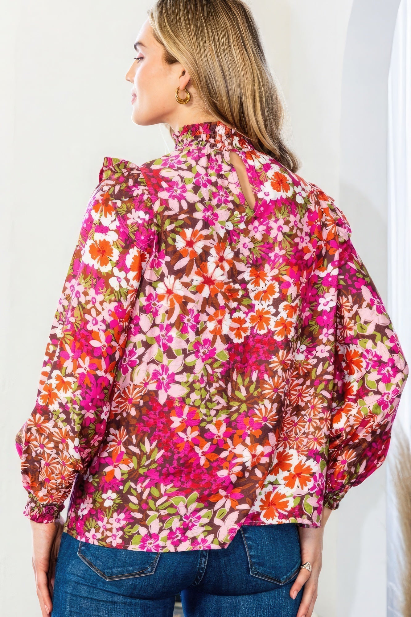 Dark pink floral blouse back view with mock neck and long puff sleeves
