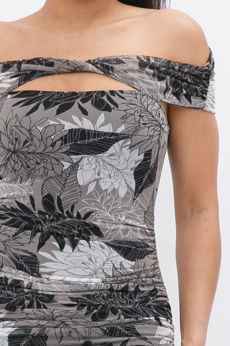 Close-up of printed mesh off-shoulder bodice with leaf pattern and gathered waist