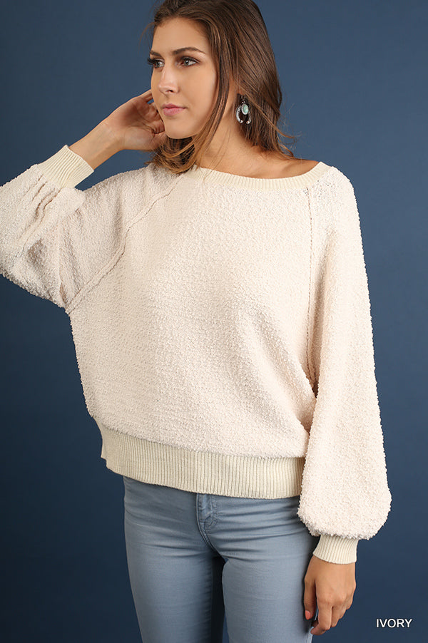 Ivory puff-sleeve boat-neck sweater, cozy textured knit with roomy wide sleeves.