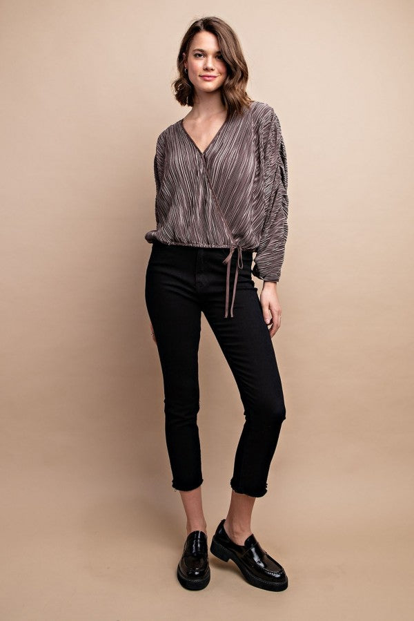 Silvery satin pleated top with drawstring waist and V-neck snap buttons