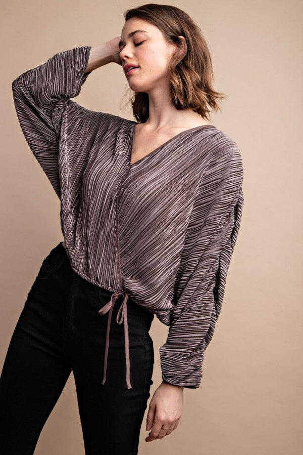 Silvery satin pleated top with V-neck, drawstring waist, long sleeves