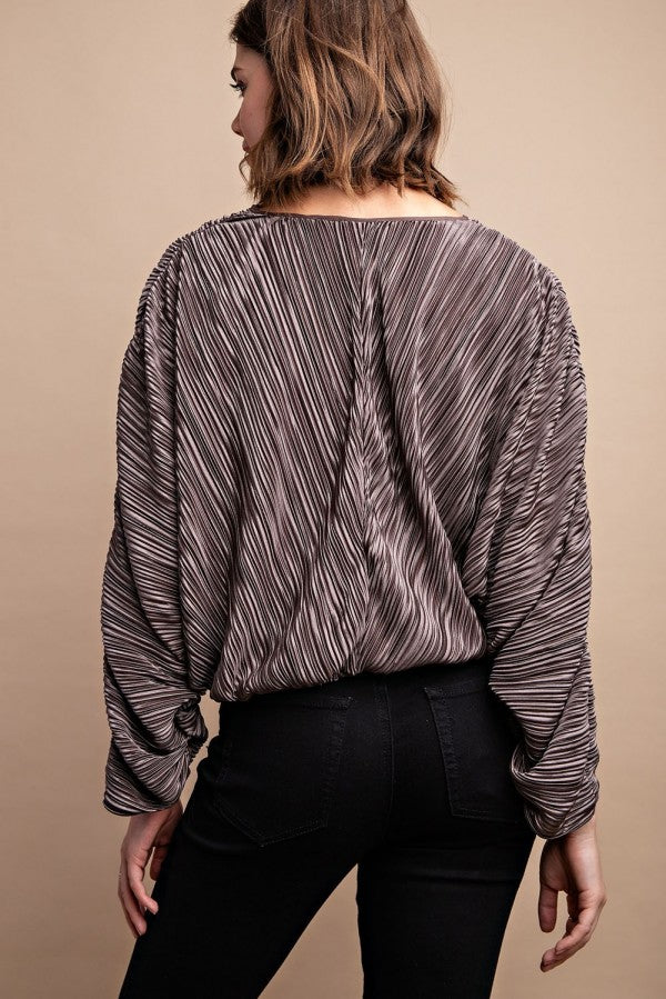 Silvery pleated satin top from back, long sleeves, drawstring waist ties