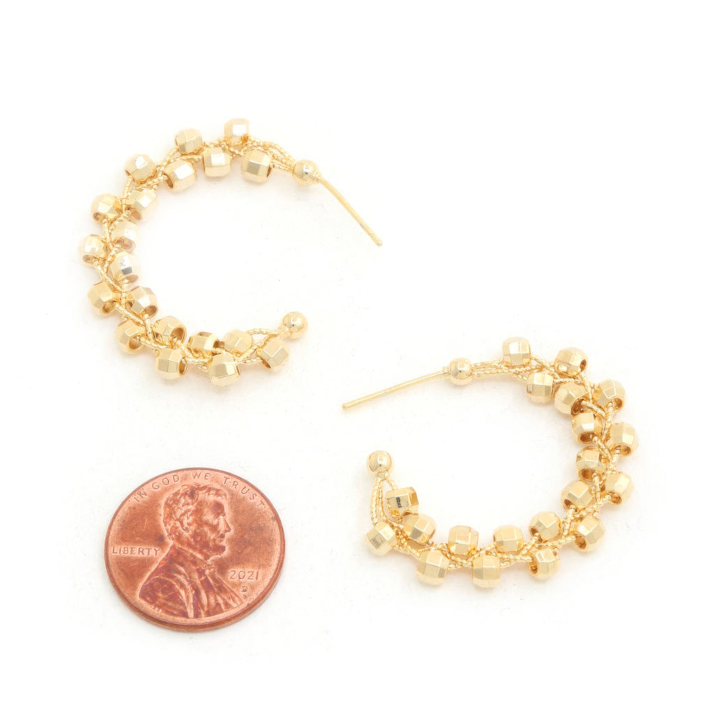 Beaded open hoop earrings with gold-dipped cube beads and hook backing detail