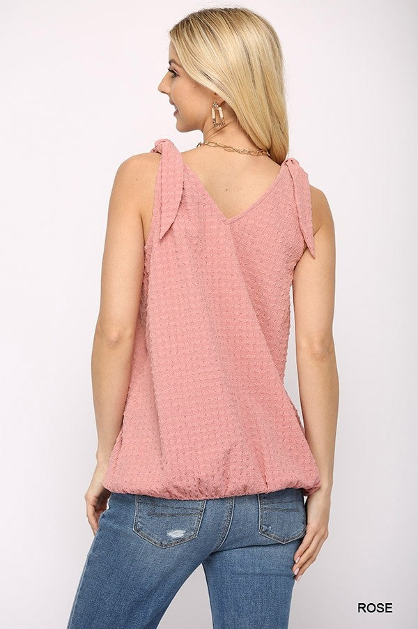 Back view of Rose sleeveless surplice top with shoulder ties and textured fabric