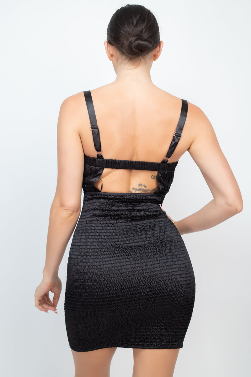 Black smocked dress back view with square cutout and adjustable shoulder straps