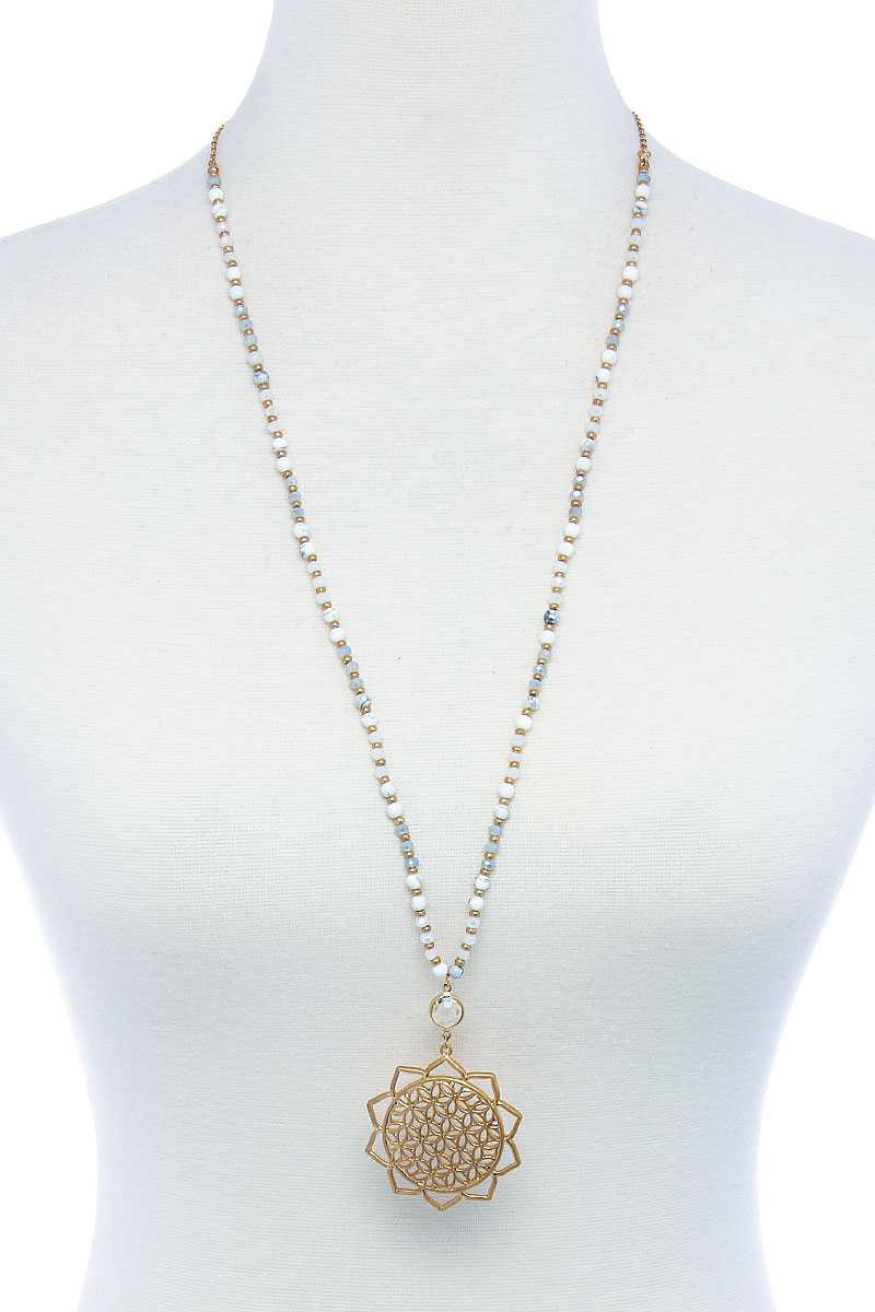 Long beaded necklace with gold sunflower pendant; cream, grey, and mint beads